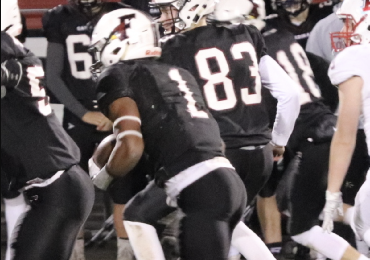 Braelon Allen runs the ball for his alma mater, Fond Du Lac High School.